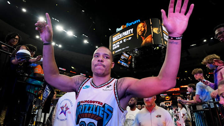 Grizzlies' Desmond Bane (22) high fives fans as he walks off the court Grizzlies' Desmond Bane (22) high fives fans as he walks off the court