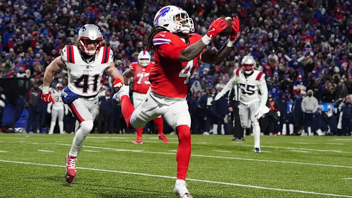 Buffalo Bills running back James Cook makes a catch for a touchdown against New England Patriots safety Brenden Schooler. Buffalo Bills running back James Cook makes a catch for a touchdown against New England Patriots safety Brenden Schooler.