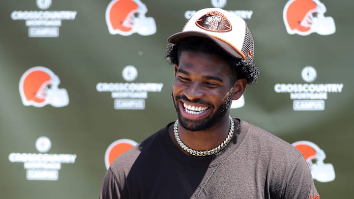 Cleveland Browns quarterback Shedeur Sanders (12) jokes about his signing bonus during a press conference before day two of NFL rookie minicamp.
