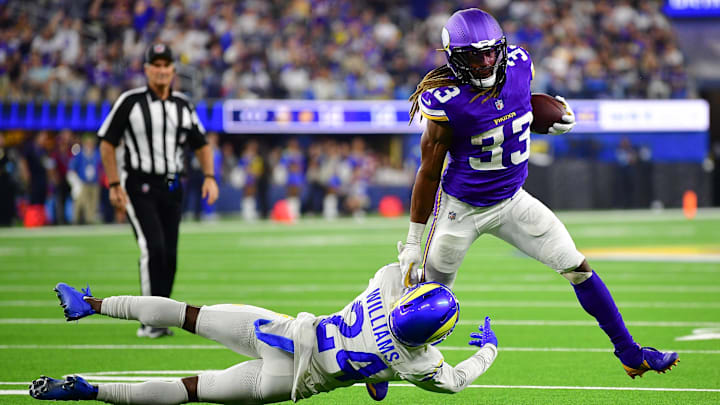 Oct 24, 2024; Inglewood, California, USA; Minnesota Vikings running back Aaron Jones (33) runs the ball against Los Angeles Rams cornerback Darious Williams (24) during the second half at SoFi Stadium. Oct 24, 2024; Inglewood, California, USA; Minnesota Vikings running back Aaron Jones (33) runs the ball against Los Angeles Rams cornerback Darious Williams (24) during the second half at SoFi Stadium.