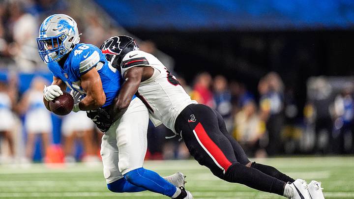 Detroit Lions running back Jacob Saylors (48) makes a catch against Houston Texans linebacker K.C. Ossai (47) during the second half at Ford Field in Detroit on Saturday, August 23, 2025. Detroit Lions running back Jacob Saylors (48) makes a catch against Houston Texans linebacker K.C. Ossai (47) during the second half at Ford Field in Detroit on Saturday, August 23, 2025.