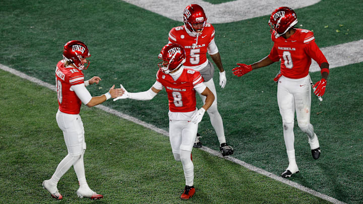 UNLV Rebels wide receiver Taeshaun Lyons (8) celebrates his touchdown with quarterback Anthony Colandrea (10) and wide receiver Koy Moore (5) and wide receiver Troy Omeire (0) in the fourth quarter against the Colorado State Rams at Sonny Lubick Field at Canvas Stadium. Mandatory Credit: Isaiah J. Downing-Imagn Images