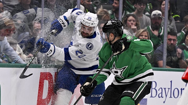 Mar 20, 2025; Dallas, Texas, USA; Dallas Stars defenseman Ilya Lyubushkin (46) and Tampa Bay Lightning left wing Nick Paul (20) battle for control of the puck during the third period at the American Airlines Center. Mandatory Credit: Jerome Miron-Imagn Images Mar 20, 2025; Dallas, Texas, USA; Dallas Stars defenseman Ilya Lyubushkin (46) and Tampa Bay Lightning left wing Nick Paul (20) battle for control of the puck during the third period at the American Airlines Center. Mandatory Credit: Jerome Miron-Imagn Images