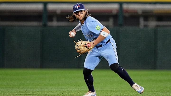 May 28, 2024; Chicago, Illinois, USA;  Toronto Blue Jays infielder Bo Bichette (11) throws to first base against the Chicago White Sox at Guaranteed Rate Field. Mandatory Credit: Jamie Sabau-USA TODAY Sports