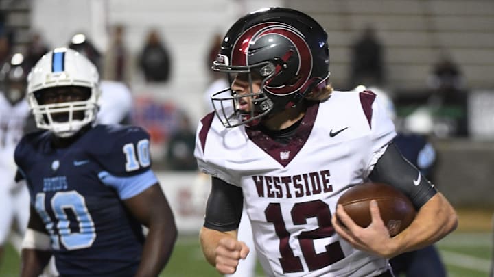 Westside (13-0) played South Florence (11-3) for the AAAA high school football championships. The game was played at South Carolina State's Oliver C. Dawson Stadium in Orangeburg on Dec. 13, 2024. South Florence High's Terry Gordon (10), left, puts pressure on Westside's Cutter Wood (12) on a play. Westside (13-0) played South Florence (11-3) for the AAAA high school football championships. The game was played at South Carolina State's Oliver C. Dawson Stadium in Orangeburg on Dec. 13, 2024. South Florence High's Terry Gordon (10), left, puts pressure on Westside's Cutter Wood (12) on a play.