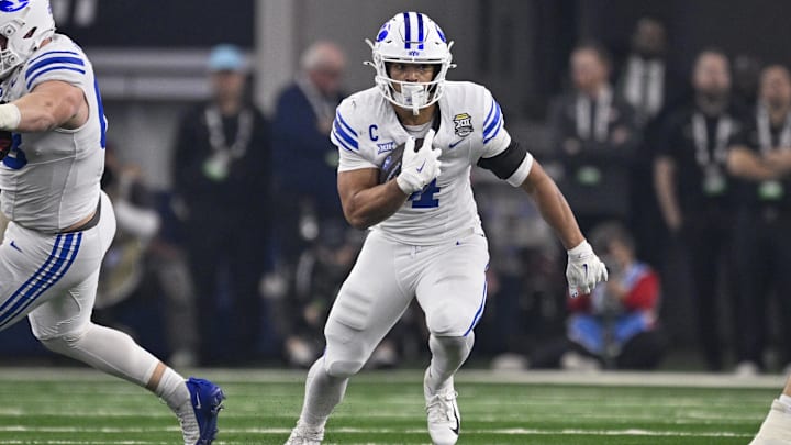 Dec 6, 2025; Arlington, TX, USA; BYU Cougars running back LJ Martin (4) runs with the ball during the game between the Red Raiders and the Cougars at AT&T Stadium. Mandatory Credit: Jerome Miron-Imagn Images