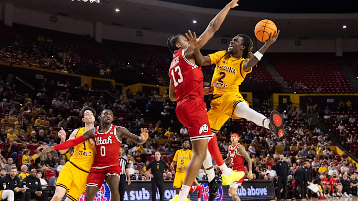 Feb 28, 2026; Tempe, Arizona, USA; Arizona State Sun Devils guard Anthony Johnson (2) drives to the basket against Utah Utes forward Kendyl Sanders (13) in the second half at Desert Financial Arena. Mandatory Credit: Mark J. Rebilas-Imagn Images