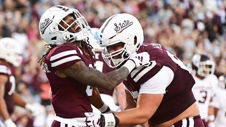 Oct 19, 2024; Starkville, Mississippi, USA;  Mississippi State Bulldogs wide receiver Kevin Coleman Jr. (3) and offensive lineman Ethan Miner (67) react after a touchdown against the Texas A&M Aggies during the fourth quarter at Davis Wade Stadium at Scott Field. Mandatory Credit: Matt Bush-Imagn Images