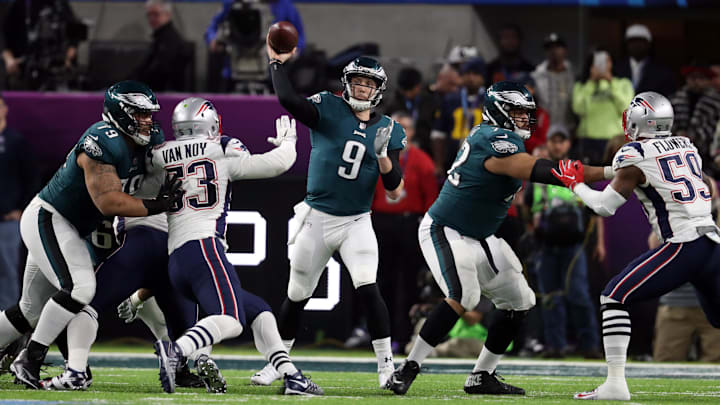 Feb 4, 2018; Minneapolis, MN, USA; Philadelphia Eagles quarterback Nick Foles (9) throws the ball under pressure by New England Patriots outside linebacker Kyle Van Noy (53) during the third quarter in Super Bowl LII at U.S. Bank Stadium. Mandatory Credit: Matthew Emmons-Imagn Images
