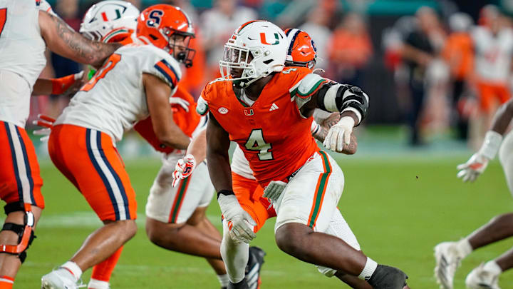 Nov 8, 2025; Miami Gardens, Florida, USA; Miami Hurricanes defensive lineman Rueben Bain Jr. (4) rushes the passer against the Syracuse Orange during the third quarter at Hard Rock Stadium. Mandatory Credit: Jeff Romance-Imagn Images Nov 8, 2025; Miami Gardens, Florida, USA; Miami Hurricanes defensive lineman Rueben Bain Jr. (4) rushes the passer against the Syracuse Orange during the third quarter at Hard Rock Stadium. Mandatory Credit: Jeff Romance-Imagn Images