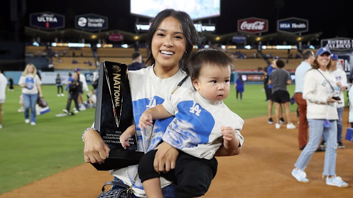 Kristen Edman, wife of Los Angeles Dodgers shortstop Tommy Edman, celebrates with his MVP trophy after the win against the New York Mets in Game 6 of the NLCS in the 2024 MLB playoffs. Kristen Edman, wife of Los Angeles Dodgers shortstop Tommy Edman, celebrates with his MVP trophy after the win against the New York Mets in Game 6 of the NLCS in the 2024 MLB playoffs.