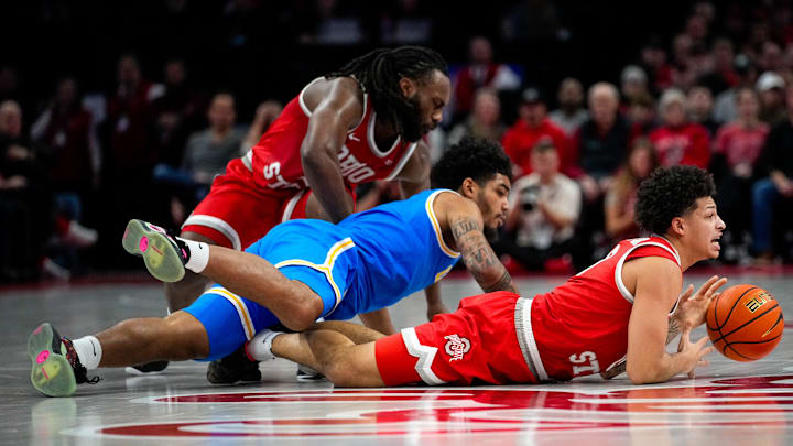 Ohio State Buckeyes guard John Mobley Jr. (0) dives for the loose ball against the UCLA Bruins in the first half at Value City Arena on Saturday, Jan. 17, 2026 in Columbus, Ohio.