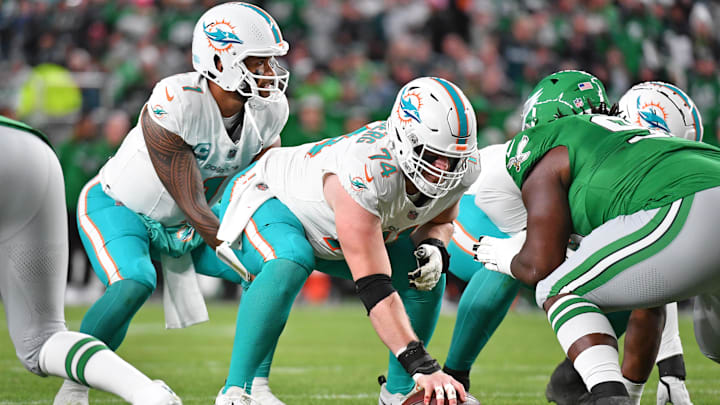 Oct 22, 2023; Philadelphia, Pennsylvania, USA;  Miami Dolphins offensive tackle Liam Eichenberg (74) snaps the ball to quarterback Tua Tagovailoa (1) against the Philadelphia Eagles at Lincoln Financial Field. Mandatory Credit: Eric Hartline-USA TODAY Sports