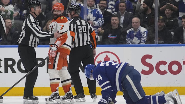 Mar 12, 2026; Toronto, Ontario, CAN; Anaheim Ducks defenseman Radko Gudas (7) looks at an injured Toronto Maple Leafs forward Auston Matthews (34) after he delivered a knee on knee hit during the second period at Scotiabank Arena. Mandatory Credit: John E. Sokolowski-Imagn Images Mar 12, 2026; Toronto, Ontario, CAN; Anaheim Ducks defenseman Radko Gudas (7) looks at an injured Toronto Maple Leafs forward Auston Matthews (34) after he delivered a knee on knee hit during the second period at Scotiabank Arena. Mandatory Credit: John E. Sokolowski-Imagn Images