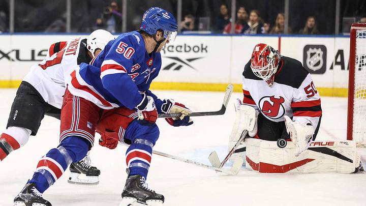 Sep 24, 2026; New York, New York, USA;  New Jersey Devils goaltender Nico Daws (50) makes a save on a shot on goal attempt by New York Rangers left wing Will Cuylle (50) in overtime at Madison Square Garden.  Mandatory Credit: Wendell Cruz-Imagn Images
