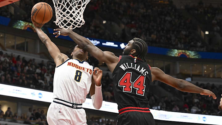 Jan 27, 2025; Chicago, Illinois, USA; Denver Nuggets forward Peyton Watson (8) shoots against Chicago Bulls forward Patrick Williams (44)