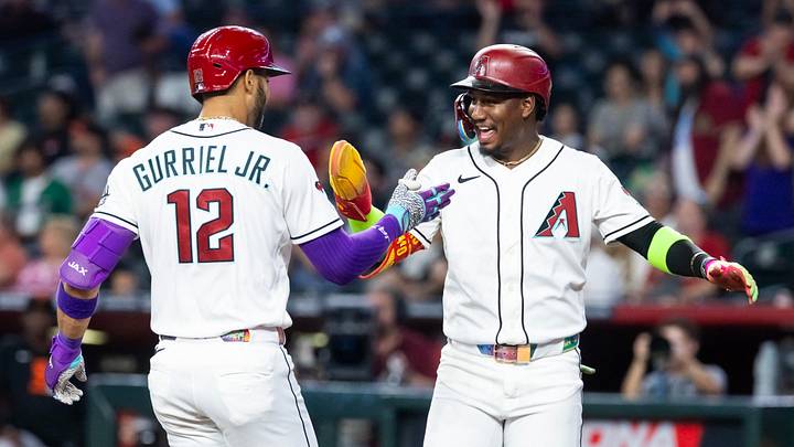 Jun 30, 2026; Phoenix, Arizona, USA; Arizona Diamondbacks outfielder Lourdes Gurriel Jr. (12) celebrates with teammate Geraldo Perdomo after hitting a three run home run in the first inning against the San Francisco Giants at Chase Field. Mandatory Credit: Mark J. Rebilas-Imagn Images