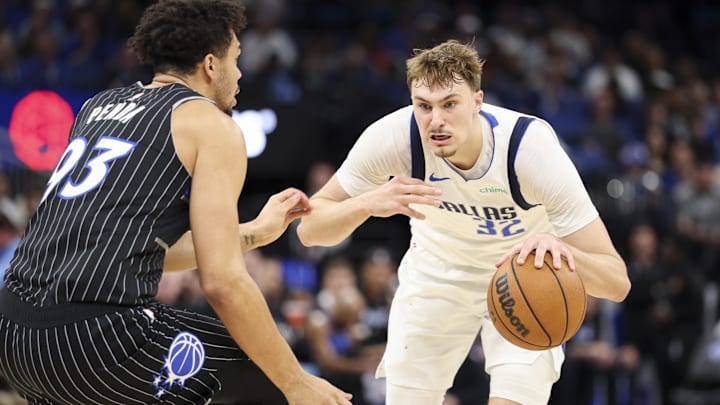 Mar 5, 2026; Orlando, Florida, USA; Dallas Mavericks forward Cooper Flagg (32) is guarded by Orlando Magic forward Noah Penda (93) in the second quarter at Kia Center. Mandatory Credit: Nathan Ray Seebeck-Imagn Images