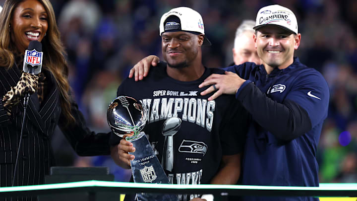 Feb 8, 2026; Santa Clara, CA, USA; Seattle Seahawks head coach Mike MacDonald and running back Kenneth Walker III (9) celebrate with the Vince Lombardi trophy after defeating the New England Patriots in Super Bowl LX at Levi's Stadium. Mandatory Credit: Mark J. Rebilas-Imagn Images