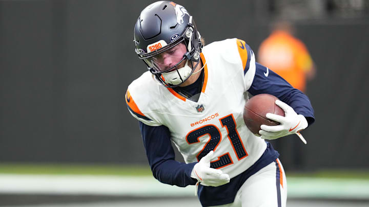 Dec 7, 2025; Paradise, Nevada, USA;  Denver Broncos cornerback Riley Moss (21) warms up prior to a game against the Las Vegas Raiders at Allegiant Stadium. Mandatory Credit: Stephen R. Sylvanie-Imagn Images