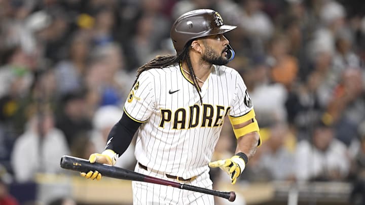 Fernando Tatis Jr. (23) hits a sacrifice fly ball during the third inning against the Colorado Rockies at Petco Park.