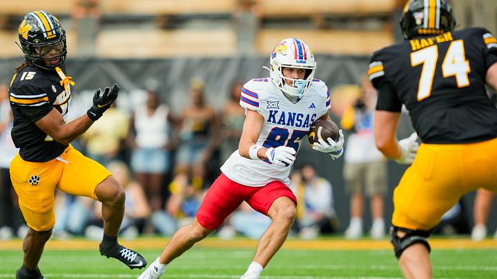 Sep 6, 2025; Columbia, Missouri, USA; Kansas Jayhawks wide receiver Tate Nagy (85) runs with the ball against Missouri Tigers safety Santana Banner (15) and offensive lineman Whit Hafer (74) during the first half at Faurot Field at Memorial Stadium. Mandatory Credit: Jay Biggerstaff-Imagn Images Sep 6, 2025; Columbia, Missouri, USA; Kansas Jayhawks wide receiver Tate Nagy (85) runs with the ball against Missouri Tigers safety Santana Banner (15) and offensive lineman Whit Hafer (74) during the first half at Faurot Field at Memorial Stadium. Mandatory Credit: Jay Biggerstaff-Imagn Images