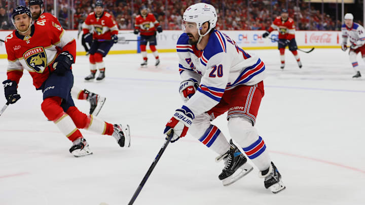 May 28, 2024; Sunrise, Florida, USA; New York Rangers left wing Chris Kreider (20) moves the puck against the Florida Panthers during the third period in game four of the Eastern Conference Final of the 2024 Stanley Cup Playoffs at Amerant Bank Arena. Mandatory Credit: Sam Navarro-USA TODAY Sports