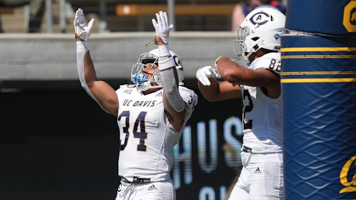 Sep 3, 2022; Berkeley, California, USA; UC Davis Aggies defensive back Kavir Bains (43) celebrates with wide receiver Chaz Davis (82) after scoring a touchdown against the California Golden Bears during the third quarter at FTX Field at California Memorial Stadium. Mandatory Credit: Darren Yamashita-Imagn Images
