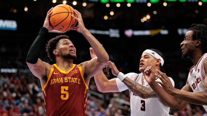 Mar 12, 2026; Kansas City, MO, USA; Iowa State Cyclones forward Joshua Jefferson (5) drives to the basket around Texas Tech Red Raiders forward LeJuan Watts (3) during the second half at T-Mobile Center. Mandatory Credit: William Purnell-Imagn Images