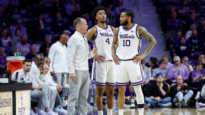 Feb 17, 2026; Manhattan, Kansas, USA; Kansas State Wildcats interim head coach Matthew Driscoll talks to Kansas State Wildcats guards P.J. Haggerty (4) and David Castillo (10) during the second half at Bramlage Coliseum. Images Feb 17, 2026; Manhattan, Kansas, USA; Kansas State Wildcats interim head coach Matthew Driscoll talks to Kansas State Wildcats guards P.J. Haggerty (4) and David Castillo (10) during the second half at Bramlage Coliseum. Images