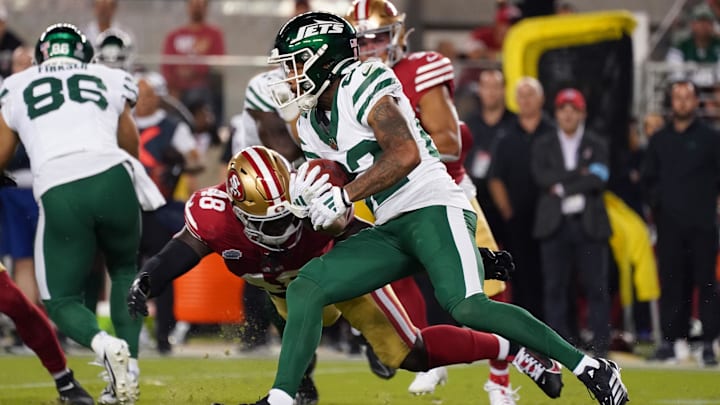 Sep 9, 2024; Santa Clara, California, USA; New York Jets wide receiver Xavier Gipson (82) returns a kickoff and avoids San Francisco 49ers linebacker Tatum Bethune (48) in the fourth quarter at Levi's Stadium. 