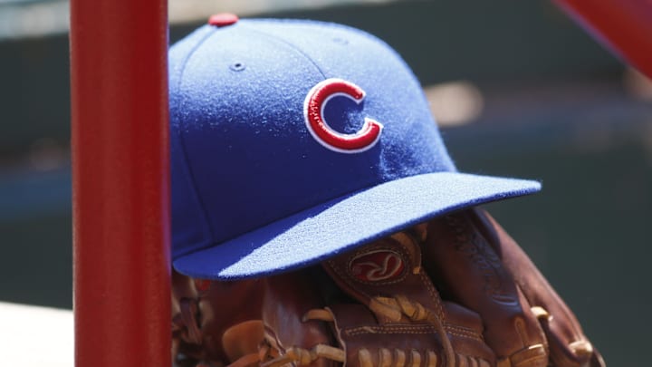 A Chicago Cubs hat and glove