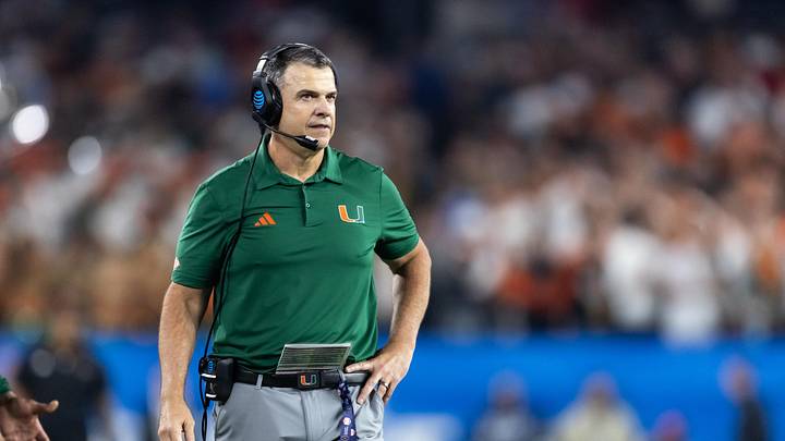 Jan 8, 2026; Glendale, AZ, USA; Miami Hurricanes head coach Mario Cristobal against the Mississippi Rebels during the 2026 Fiesta Bowl and semifinal game of the College Football Playoff at State Farm Stadium. Mandatory Credit: Mark J. Rebilas-Imagn Images Jan 8, 2026; Glendale, AZ, USA; Miami Hurricanes head coach Mario Cristobal against the Mississippi Rebels during the 2026 Fiesta Bowl and semifinal game of the College Football Playoff at State Farm Stadium. Mandatory Credit: Mark J. Rebilas-Imagn Images