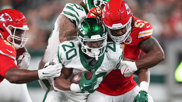 Oct 1, 2023; East Rutherford, New Jersey, USA; New York Jets running back Breece Hall (20) is tackled by Kansas City Chiefs defensive end Mike Danna (51) during the first half at MetLife Stadium. Mandatory Credit: Vincent Carchietta-Imagn Images Oct 1, 2023; East Rutherford, New Jersey, USA; New York Jets running back Breece Hall (20) is tackled by Kansas City Chiefs defensive end Mike Danna (51) during the first half at MetLife Stadium. Mandatory Credit: Vincent Carchietta-Imagn Images