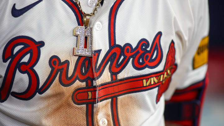 May 19, 2024; Atlanta, Georgia, USA; A detailed view of the chain and jersey of Atlanta Braves shortstop Orlando Arcia (11) against the San Diego Padres in the seventh inning at Truist Park. Mandatory Credit: Brett Davis-Imagn Images
