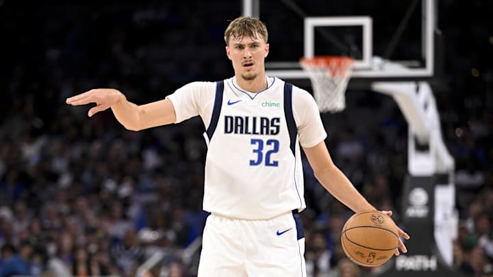 Oct 6, 2025; Fort Worth, Texas, USA; Dallas Mavericks forward Cooper Flagg (32) sets the play as he brings the ball up the court against the Oklahoma City Thunder during the second quarter at Dickie's Arena. Mandatory Credit: Jerome Miron-Imagn Images