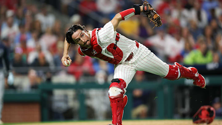 Sep 9, 2024; Philadelphia, Pennsylvania, USA; Philadelphia Phillies catcher Garrett Stubbs (21) fields a ball Tampa Bay Rays at Citizens Bank Park.
