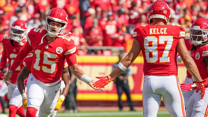 Sep 15, 2024; Kansas City, Missouri, USA; Kansas City Chiefs quarterback Patrick Mahomes (15) greets tight end Travis Kelce (87) during player introductions against the Cincinnati Bengals prior to a game at GEHA Field at Arrowhead Stadium. Mandatory Credit: Denny Medley-Imagn Images