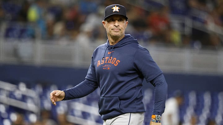 Aug 6, 2025; Miami, Florida, USA;  Houston Astros manager Joe Espada (19) walks back from the pitcher's mound against the Miami Marlins during the fourth inning at loanDepot Park. Mandatory Credit: Rhona Wise-Imagn Images