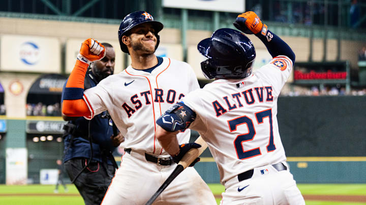 Houston Astros players Jeremy Peña and Jose Altuve celebrate with each other.