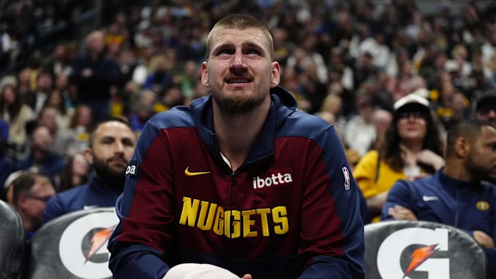 Feb 20, 2025; Denver, Colorado, USA; Denver Nuggets center Nikola Jokic (15) while on the bench in the third quarter against the Charlotte Hornets at Ball Arena. Mandatory Credit: Ron Chenoy-Imagn Images