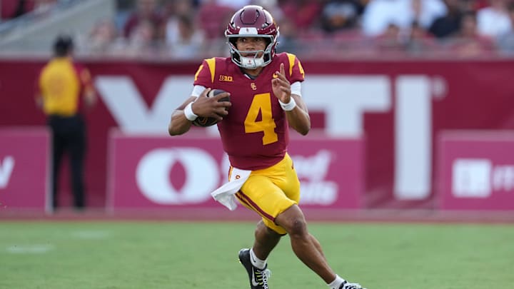 Aug 30, 2025; Los Angeles, California, USA; Southern California Trojans quarterback Husan Longstreet (4) carries the ball against the Missouri State Bears in the second half at United Airlines Field at Los Angeles Memorial Coliseum. Mandatory Credit: Kirby Lee-Imagn Images