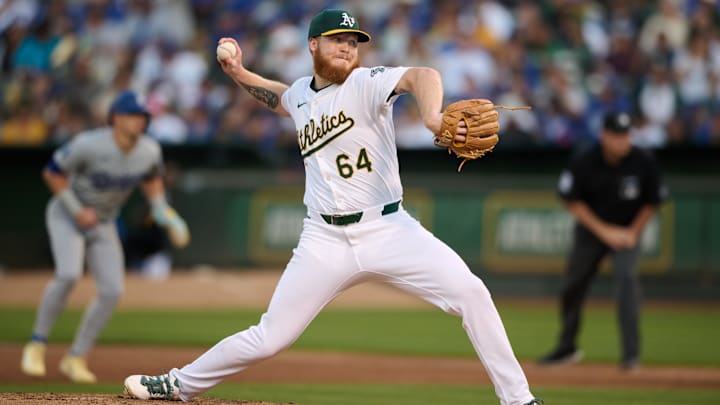 Aug 3, 2024; Oakland, California, USA; Oakland Athletics pitcher Will Klein (64) throws against the Los Angeles Dodgers during the sixth inning at Oakland-Alameda County Coliseum. Mandatory Credit: Robert Edwards-Imagn Images