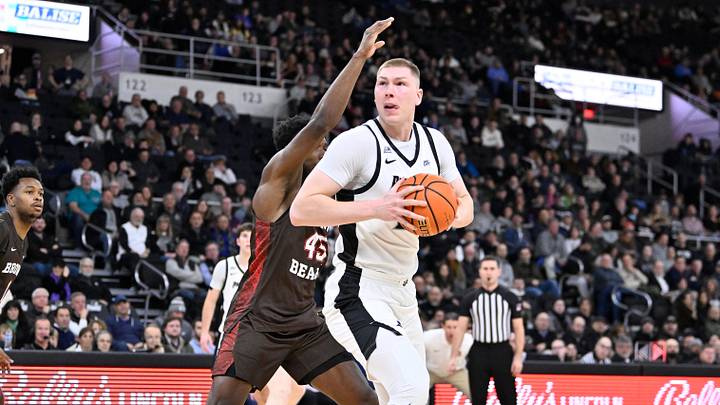 Dec 9, 2025; Providence, Rhode Island, USA; Providence Friars forward Peteris Pinnis (17) is defended by Brown Bears forward N'Famara Dabo (45) during the first half at Amica Mutual Pavilion. Mandatory Credit: Eric Canha-Imagn Images