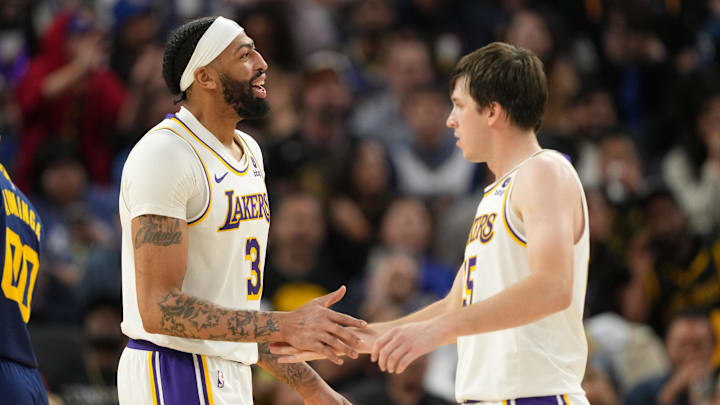 Jan 27, 2024; San Francisco, California, USA; Los Angeles Lakers forward Anthony Davis (3) celebrates with guard Austin Reaves (right) during the fourth quarter against the Golden State Warriors at Chase Center. Mandatory Credit: Darren Yamashita-Imagn Images