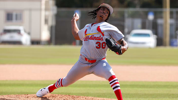 Feb 14, 2026; Jupiter, FL, USA; St. Louis Cardinals pitcher Tink Hence (30) delivers a pitch during a spring training workout at Roger Dean Chevrolet Stadium. Mandatory Credit: Sam Navarro-Imagn Images