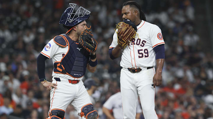 Cesar Salazar talking with Framber Valdez during a mound visit. 