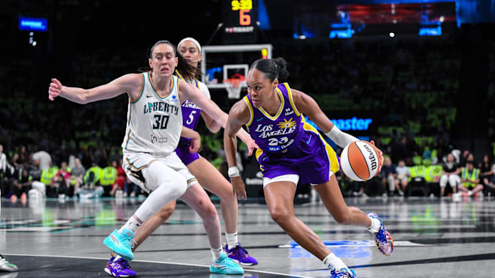 Jul 26, 2025; Brooklyn, New York, USA; Los Angeles Sparks forward Azura Stevens (23) drives past New York Liberty forward Breanna Stewart (30) during the first half at Barclays Center. Mandatory Credit: John Jones-Imagn Images Jul 26, 2025; Brooklyn, New York, USA; Los Angeles Sparks forward Azura Stevens (23) drives past New York Liberty forward Breanna Stewart (30) during the first half at Barclays Center. Mandatory Credit: John Jones-Imagn Images