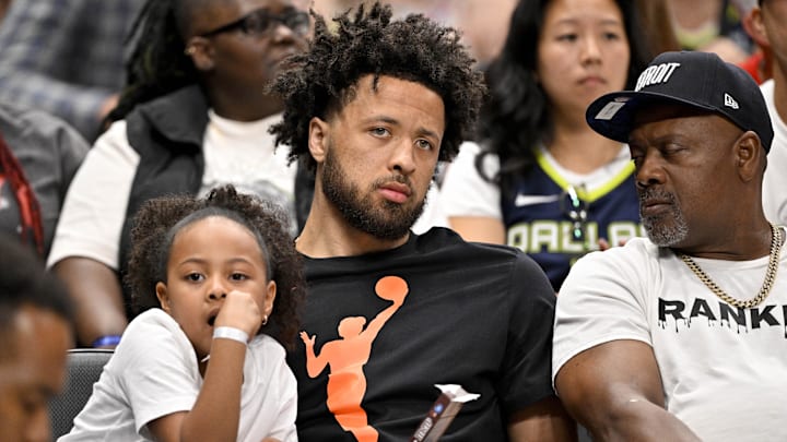 Jun 27, 2025; Dallas, Texas, USA; Detroit Pistons point guard Cade Cunningham watches the game between the Dallas Wings and the Indiana Fever during the second half at the American Airlines Center. Mandatory Credit: Jerome Miron-Imagn Images