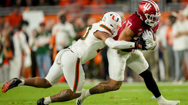 Miami defensive back Keionte Scott works to bring down Indiana Hoosiers tight end Riley Nowakowski in the national title game. Miami defensive back Keionte Scott works to bring down Indiana Hoosiers tight end Riley Nowakowski in the national title game.